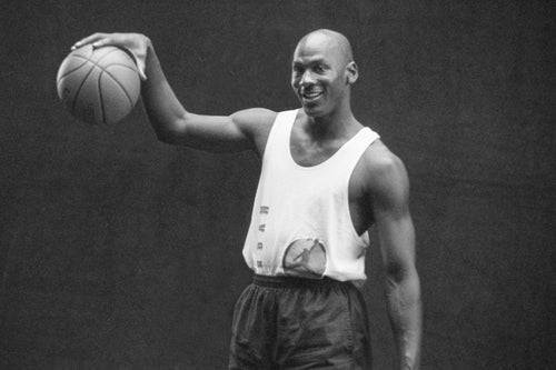 michael jordan holding jordan 1