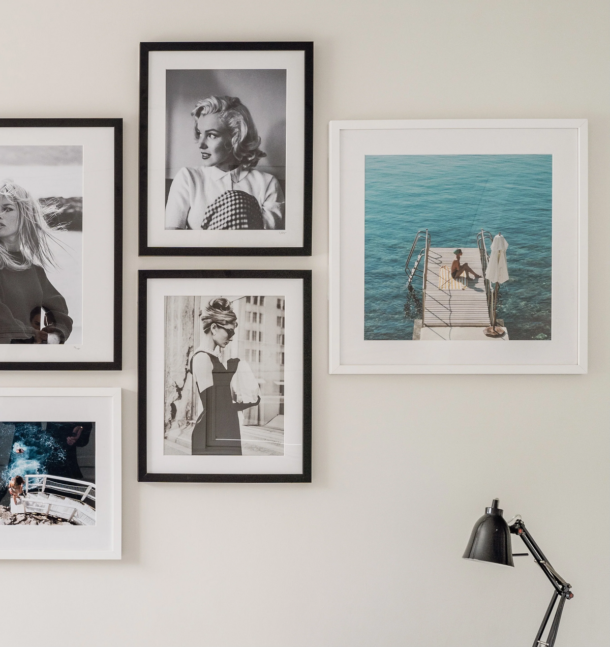 Loose colorful Slim Aarons style pool and seaside photographic prints spread out with white borders